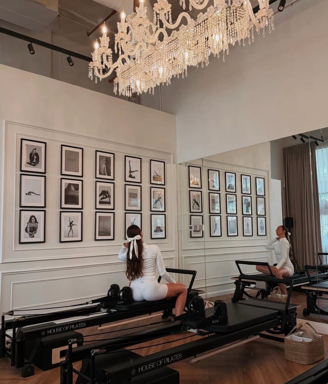 woman sitting on pilates bed